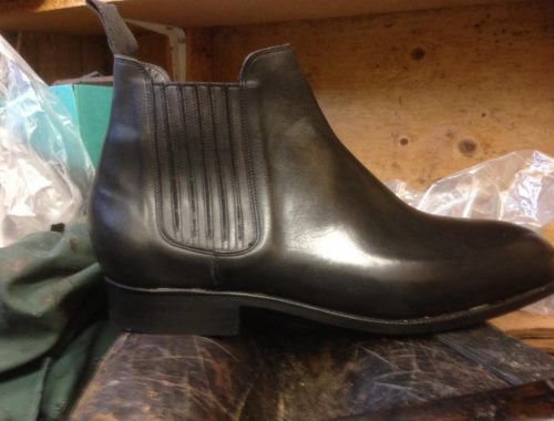 Black leather Chelsea boot with leather strip insert